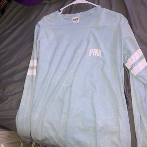 Pink long sleeve top.